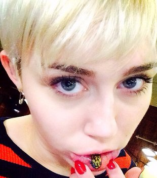 Miley Cyrus Sad Kitty Lip Tattoo